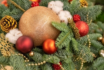 Christmas composition with spruce branches, balls and cotton