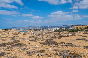 Rocky coast of Paphos, Cyprus. Tombs of the Kings tourist attraction. 