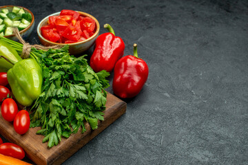 side close view of plate stand with vegetables over and near to it and with free place for your text on dark grey background