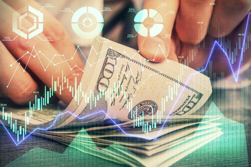 Multi exposure of forex graph drawing hologram and USA dollars bills and man hands. Technical Analysis concept.