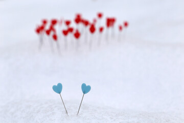Blue and red hearts on a snow. Diversity of love, background for romantic greeting card, Valentine's day