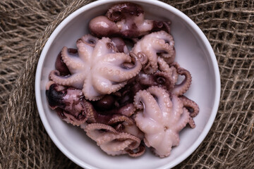 Small mini baby octopuses cooked in marinade.