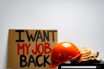 Ptotestive placards against job loss during coronavirus pandemic