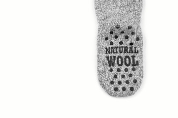 Socks with anti-slip rubber sole. Sheep wool socks isolated on white