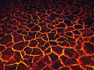 Heat red cracked ground texture burning after volcano eruption. Molten active lava texture...