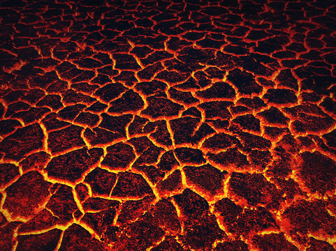 Heat red cracked ground texture burning after volcano eruption. Molten active lava texture background. Armageddon natural disaster or hell concept. Earth fissures, break into pieces. Fracture pattern