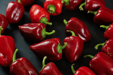 Red peppers on black background