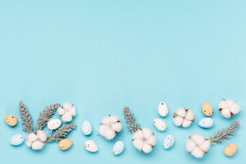 Craft Easter eggs on blue pastel background, space for text. Flat lay image composition, top view.