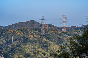Obraz premium Power cable on mountain in Saga prefecture, JAPAN. Power cable has been connected in the transmission steel towers.