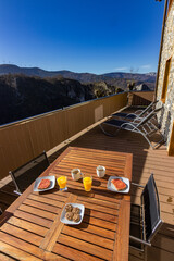 Breakfast in the terrace with views of the mountain