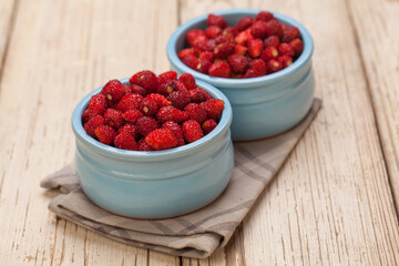 Strawberries on white wooden board background