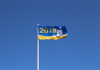 The blue and yellow seaside award flag which guarantees a clean, safe and well managed beach.