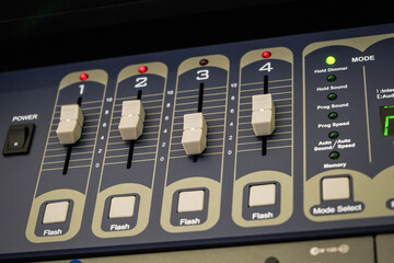 Buttons for a professional audio mixer used at press conferences