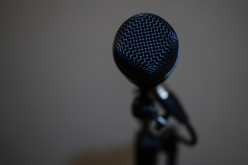 microphone placed on stand with white background in a conference room