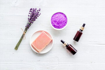 Fototapeta na wymiar Set of lavender cosmetics products with spa beauty essential oil and herbs