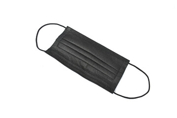 Black protection face mask with ear straps. Procedure mask to cover mouth and nose to protect from virus and bacteria. Medical respiratory masks for personal health safety.