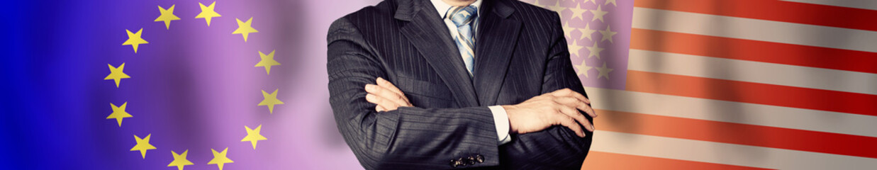 Businessman or politics arms on EU and USA flag background