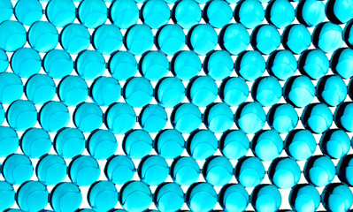 Abstract background. Macro of gel balls. Bright blue hydrogel round shape. Perspective geometry wallpaper. Concept of purity, transparency