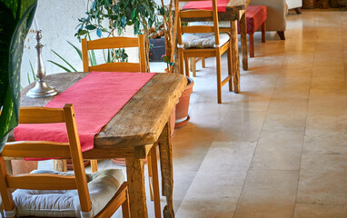 Beautiful interior decoration with wooden tables and chairs