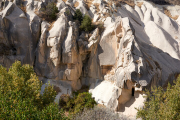 Ancient cave houses  and rock formations near Goreme, Cappadocia, Turkey