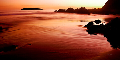 Petrel cove sunset coast reflections and rocks