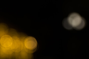 Defocused garland lights, Bokeh effect. Sparkling and fairy background. Christmas and New Year holidays concept.