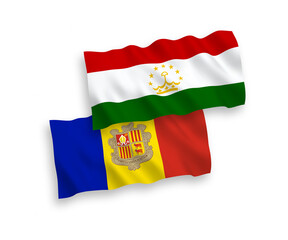 National vector fabric wave flags of Tajikistan and Andorra isolated on white background. 1 to 2 proportion.