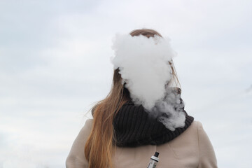 the face is covered by a cloud of steam