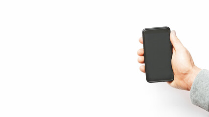 A man's hand holds a smartphone on a white background with copy space for text. business concept