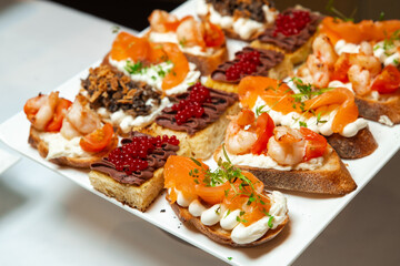 Сatering. Banquet table with different snacks and desserts