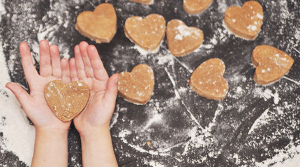 Homemade hearts cookies on a black background 