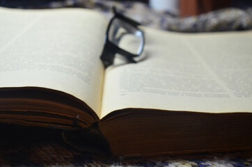 Glasses on an old book.