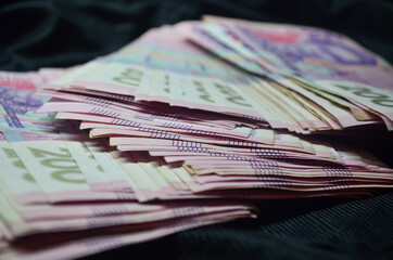 Large amount of money. Currency of Ukraine. Stack. Finance. Stocks, credit, debt.