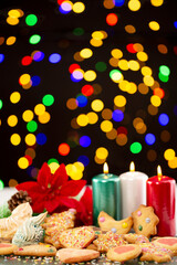 Fototapeta na wymiar Christmas set with homemade cookies, ornament, candles and lights.
