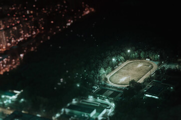 football field in the forest at night