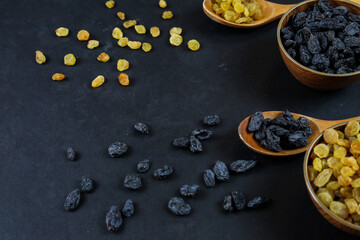 Dried raisins on black background