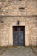 An old door in a sandstone wall