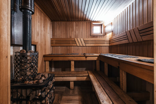 wooden bath, sauna interior. Dressing room, steam room, simple rustic decor