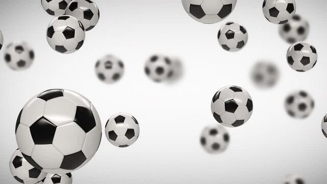 Soccer balls falling from top to bottom on a white and green background with depth of field. 4K 3D animation contains depth pass.