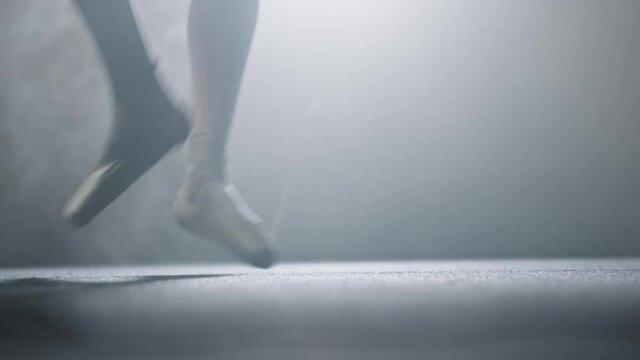 Young woman ballerina doing a pirouette on her pointes