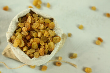 Dried raisins on white background