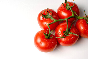 juicy ripe tomatoes on a white background close up
