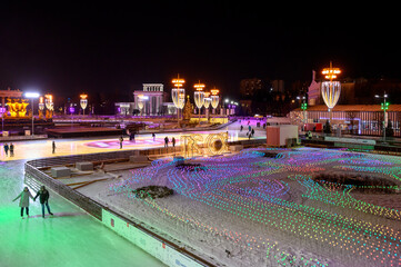 VDNKh skating rink and New Year's and Christmas decorations at the Peoples' Friendship Square of VDNKh, Moscow, Russian Federation, December 05, 2020