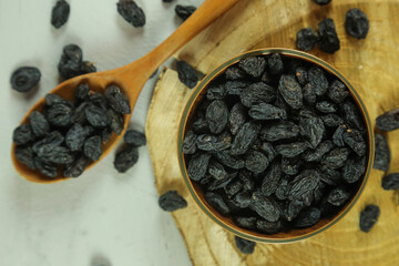 Dried raisins on white background