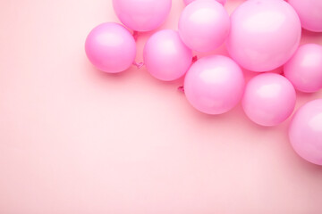 Pink balloons on pastel pink background. Birthday, holiday concept.