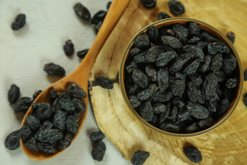 Dried raisins on white background