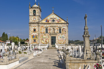 Naklejka na ściany i meble facade covered with azulejos of the Nossa Senhora do Amparo Church located in Valega, district of Aveiro, Portugal