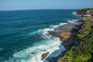 Dramatic rocky coastline of the Shark Point on the Coogee - Bondi Coastal Walk near Sydney, New South Wales, Australia