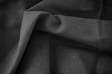 Folded fabric texture background. Black and white.