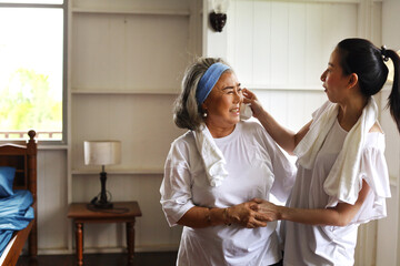 Stay home from COVID-19 Mother and daughter exercise at home During the holidays.